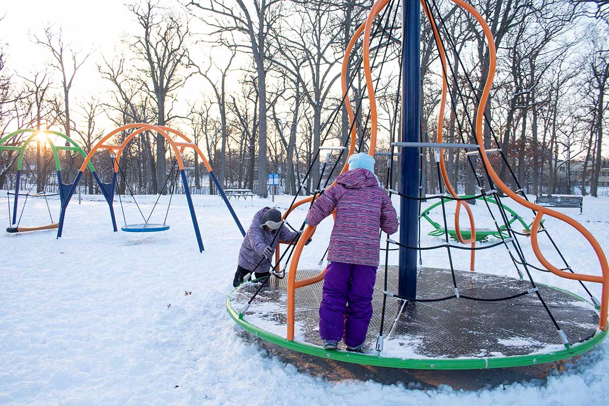 kids playing at pierce park playground in winter in appleton