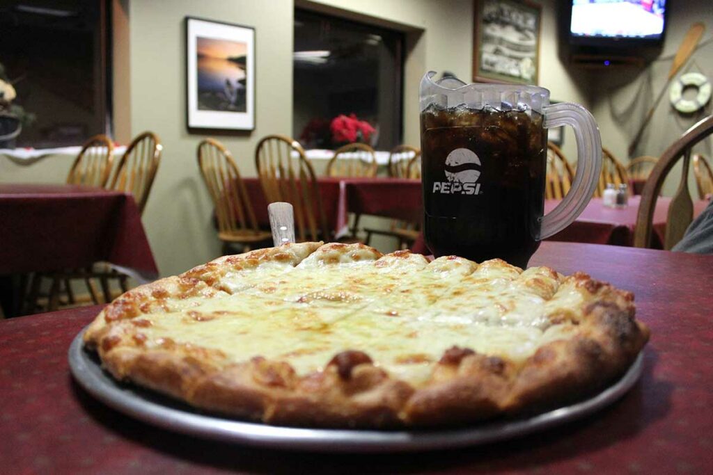 Fresh pizza and pitcher of soda at Minocqua Pizza Company in Wisconsin