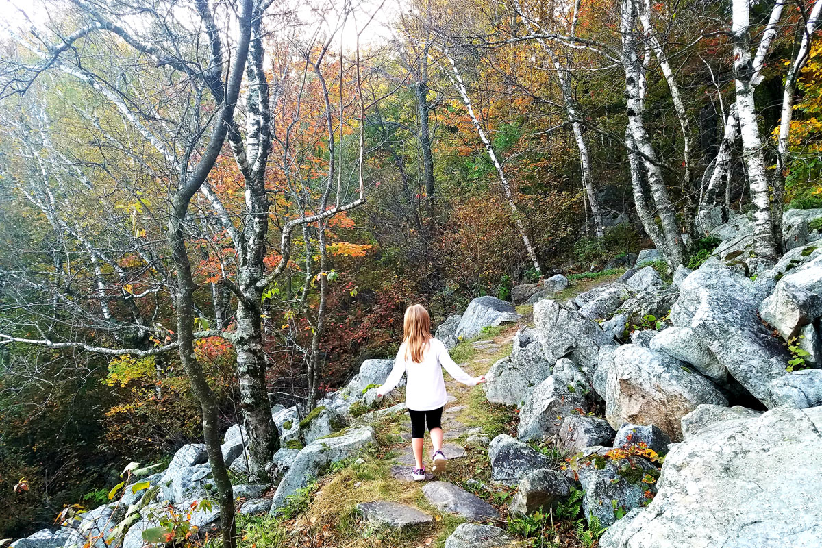 Kid hiking at Rib Mountain State Park in Fall