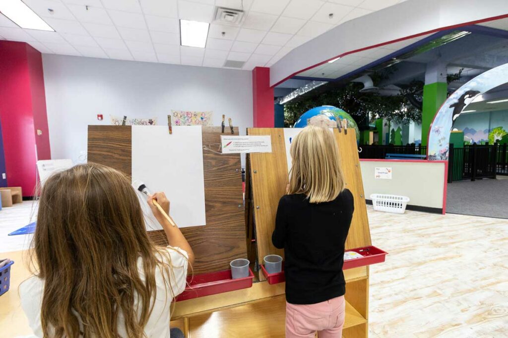 kids painting at the Building for Kids art room