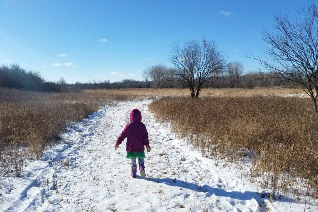 Family friend hiking train in winter in appleton