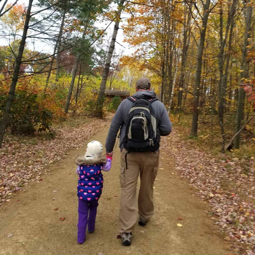 Family hiking in Fall at Navarino Nature Center