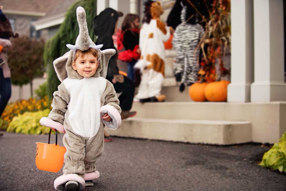 child in Halloween costume trick or treating