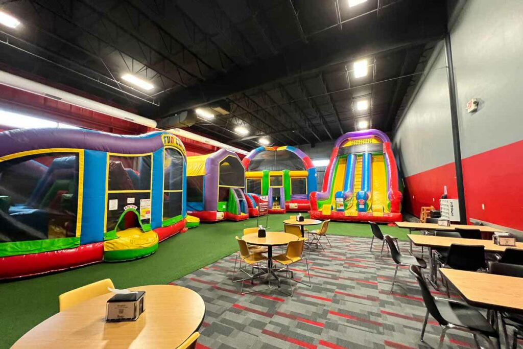 Inflatables and seating area at Badger Sports Park in Appleton.